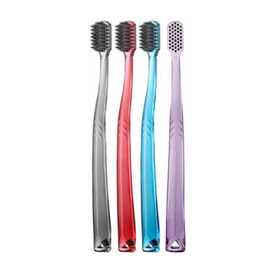 How does the Breathable Soft Charcoal Toothbrush help reduce the residual moisture in the bristle holes?