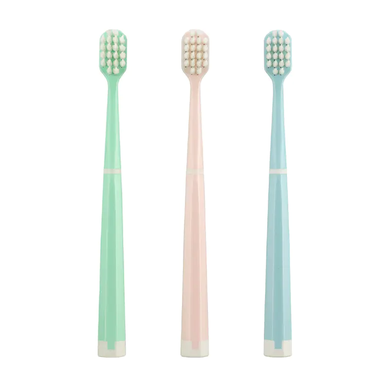 Which types of people are suitable for soft, medium, and hard bristles on a manual toothbrush?